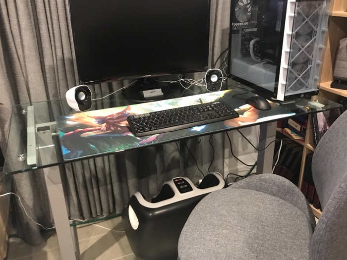 Desk home setup with foot massager