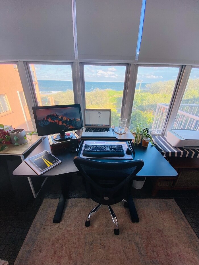 Sit stand desk setup at a beautiful home