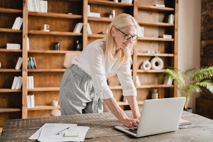 Woman standing while working from home