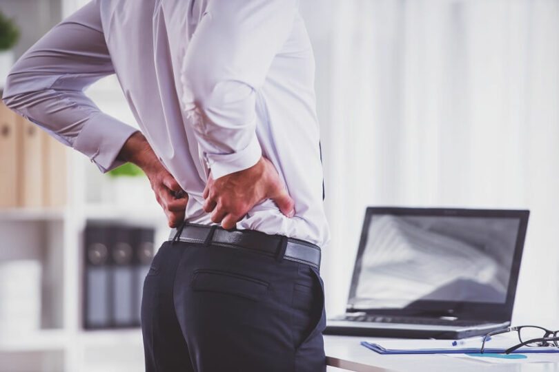 back pain attack in the office