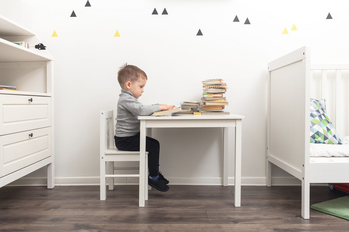 A boy drawing on his study table